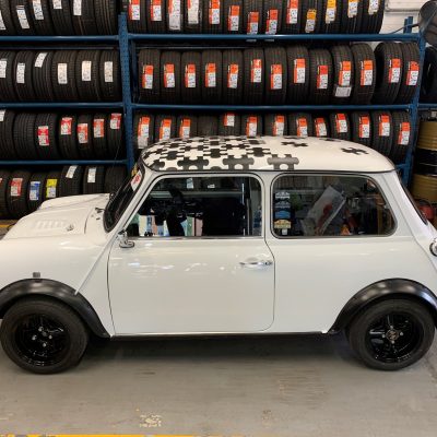 A side profile for a beautiful white classic mini here for a service at HiQ Tyres & Autocare Maidstone