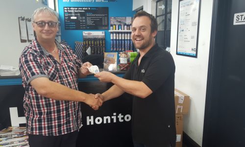 HiQ Honiton - Julian handing over Love2Shop vouchers