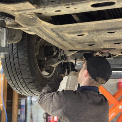 Hi Q Tewkesbury Mechanic working under car