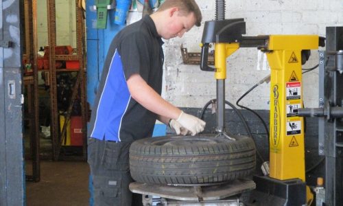HiQ Burton Eoin working on a tyre
