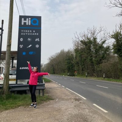 Hi Q Tyres Autocare Ashford March Visit Han in front of sign