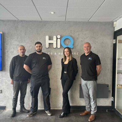 Hi Q Thatcham Team in front of Hi Q Logo 2