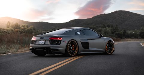Matte Grey Audi R8 parked on yellow lines at mountain side
