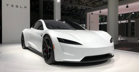 White Tesla Electric Vehicle sat in Show Room