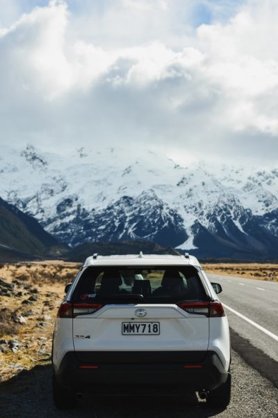 White Toyota with mountain landscape